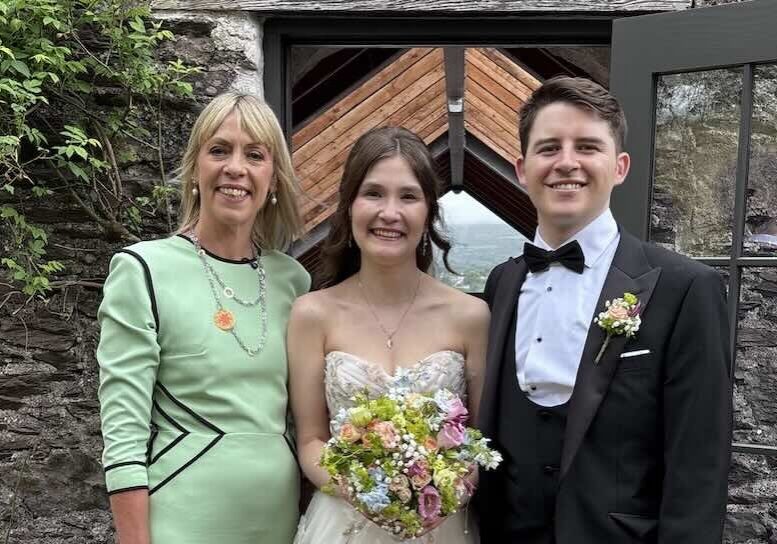 Celebrant with bride and groom